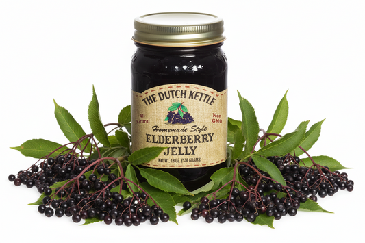 Jar of Elderberry Jelly with a gold lid and brown label on a white background